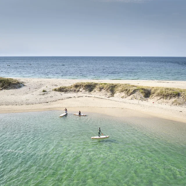 Aerial view of paddleboarders near the Mousterlin Dunes