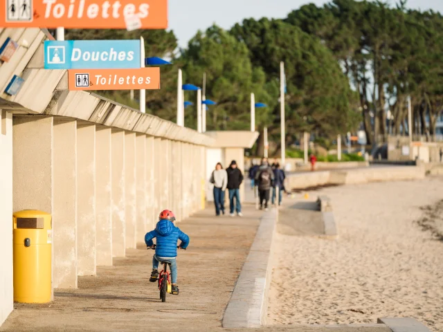 Little boy on his bike along Plage du Trez