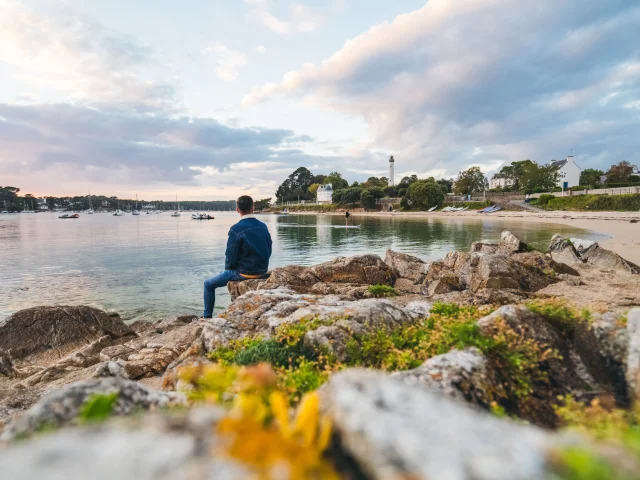 Visitor contemplating the Pyramid lighthouse from Pointe du Coq