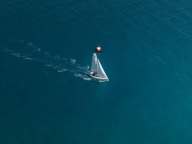 Aerial view of a sailing boat in the Bay of Bénodet
