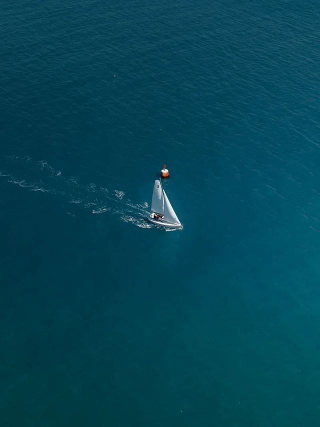 Aerial view of a sailing boat in the Bay of Bénodet